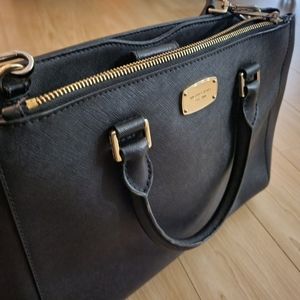 Used Michael Kohrs black purse